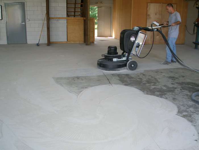 Diamond grinding concrete before epoxy floor coating application