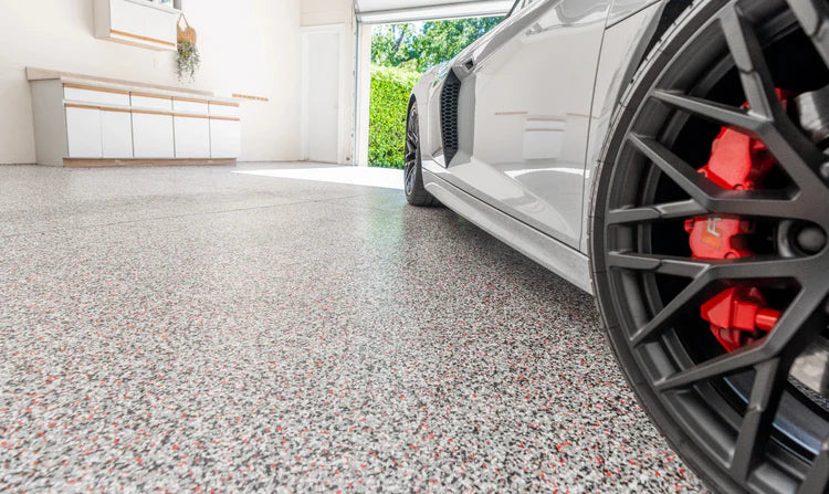 Finished flake epoxy garage floor with high-gloss topcoat ready for use in Ventura, CA